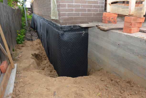 Happy homeowners after waterproofing job in Edgewater